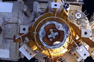 Docking module (DM) and docking target. Optical Properties Monitor (OPM) is also visible on the edge of the DM. 